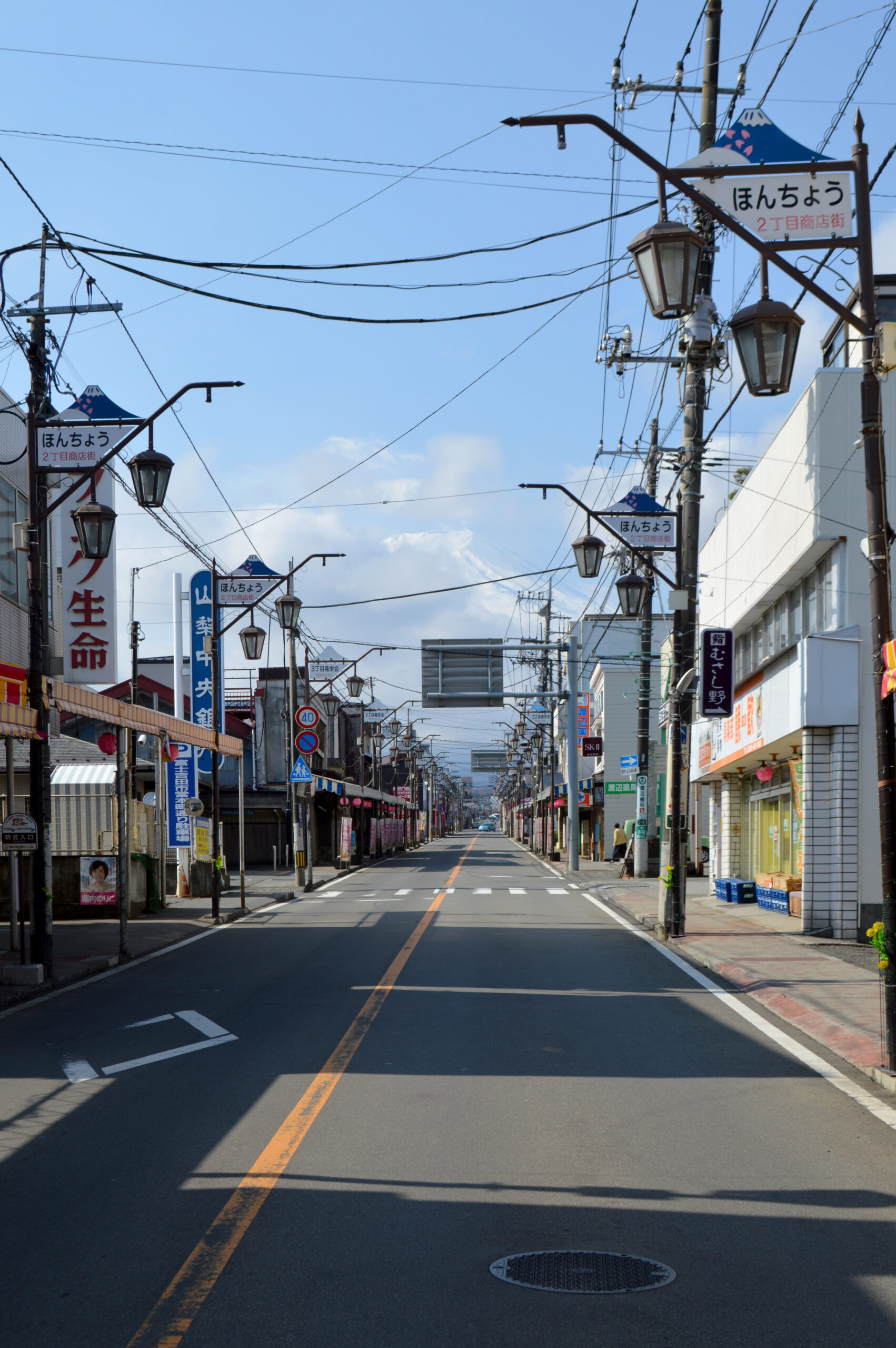 Mount Fuji rising above Honcho Street, Fujiyoshida, daytime