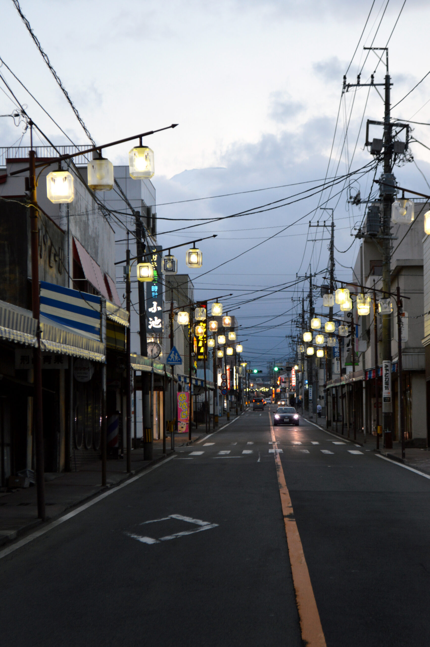 Mount Fuji above Honcho Street, Fujiyoshida, evening